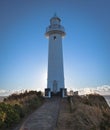 Towering Lighthouse on Cape on Coastline in Japan